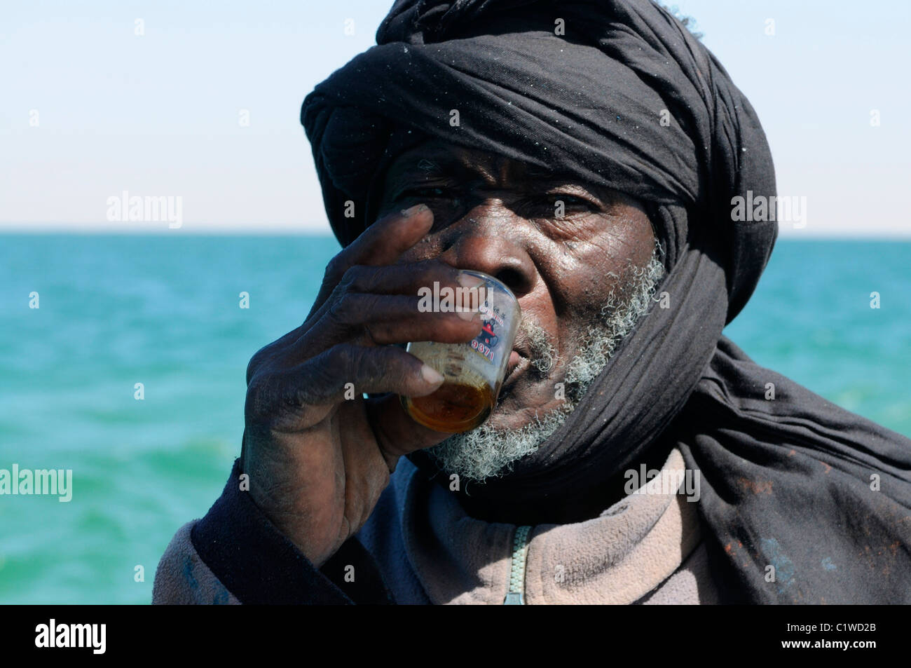 Mauritania, Banc d`Arguin, portrait of Imraguen fisherman drinking tea